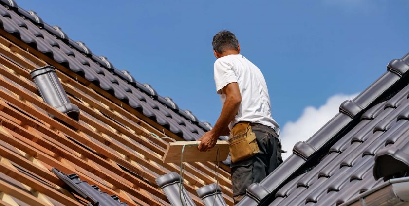 Roofer working hard