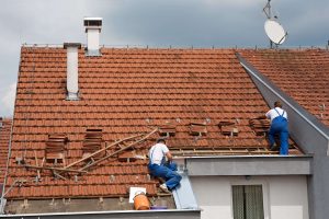 Roofers on a roof